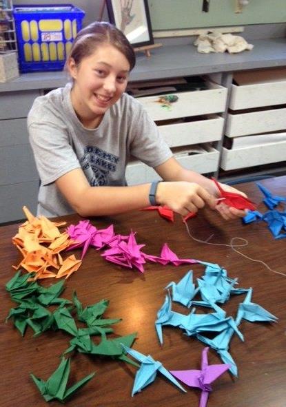 Folding a thousand cranes.